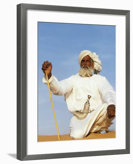 Bedouin Man Kneels on Top of a Sand Dune in the Desert-John Warburton-lee-Framed Photographic Print