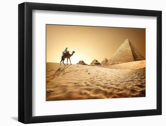 Bedouin on Camel near Pyramids in Desert-Givaga-Framed Photographic Print