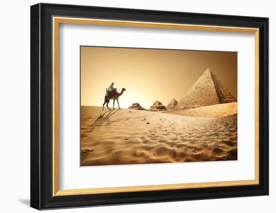 Bedouin on Camel near Pyramids in Desert-Givaga-Framed Photographic Print
