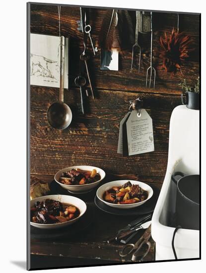 Beef Stew with Carrots and Potatoes in a Rustic Kitchen - Conde Nast Collection-null-Mounted Photographic Print