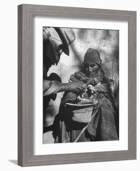 Beggar Being Given Coca Leaves-Eliot Elisofon-Framed Photographic Print