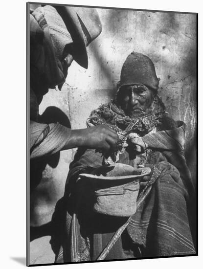 Beggar Being Given Coca Leaves-Eliot Elisofon-Mounted Photographic Print