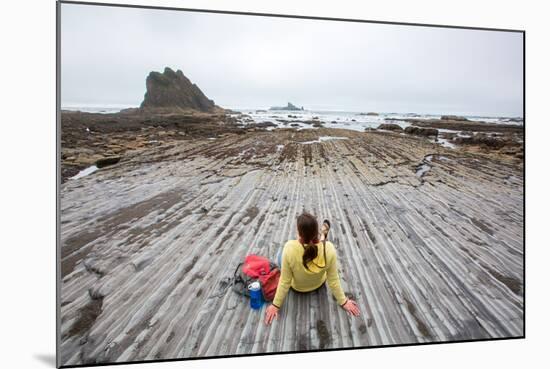 Bekah Herndon Sits On Rock Formations During Hike On Rialto Beach In The Olympic NP In Washington-Ben Herndon-Mounted Photographic Print