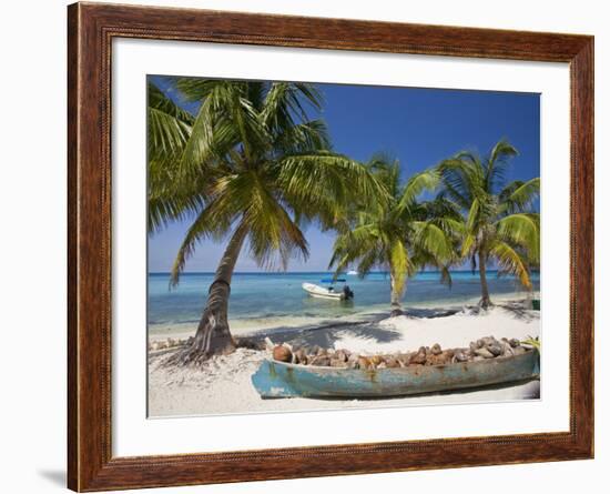 Belize, Laughing Bird Caye, Canoe Filled with Coconut Husks on Beach-Jane Sweeney-Framed Photographic Print