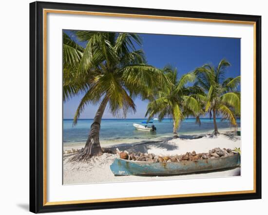 Belize, Laughing Bird Caye, Canoe Filled with Coconut Husks on Beach-Jane Sweeney-Framed Photographic Print