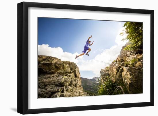 Ben Rueck Catches Some Air During A High Mountain Trail Run Just Outside Marble, CO-Dan Holz-Framed Photographic Print