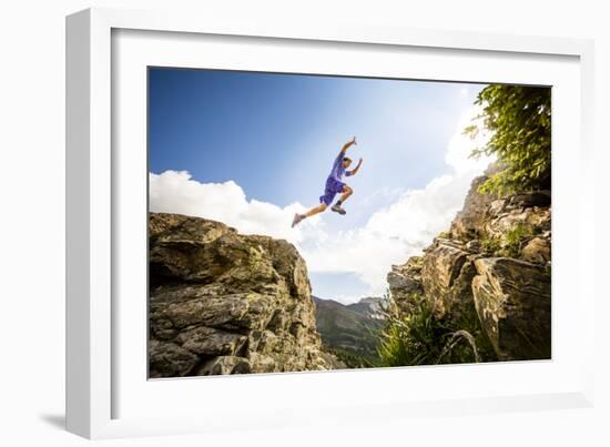 Ben Rueck Catches Some Air During A High Mountain Trail Run Just Outside Marble, CO-Dan Holz-Framed Photographic Print