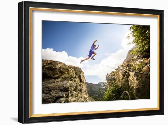 Ben Rueck Catches Some Air During A High Mountain Trail Run Just Outside Marble, CO-Dan Holz-Framed Photographic Print