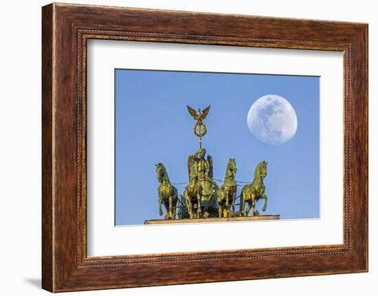 Berlin, Germany. Close-up of the Quadriga atop the Brandenburg gate with the full moon.-Miva Stock-Framed Photographic Print