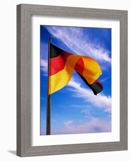 Berlin, Germany. Flag of the Federal Republic Of Germany on a flagpole waving in the breeze.-Miva Stock-Framed Photographic Print