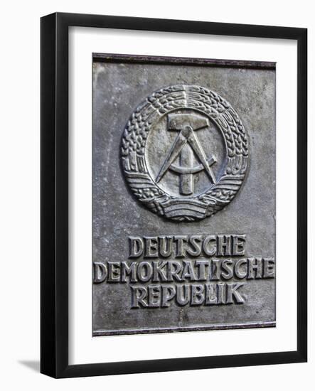 Berlin, Germany. Section of the Berlin Wall with the seal of the German Democratic Republic-Miva Stock-Framed Photographic Print