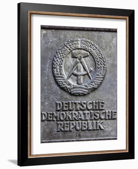 Berlin, Germany. Section of the Berlin Wall with the seal of the German Democratic Republic-Miva Stock-Framed Photographic Print