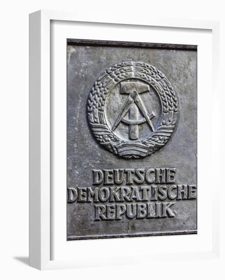 Berlin, Germany. Section of the Berlin Wall with the seal of the German Democratic Republic-Miva Stock-Framed Photographic Print