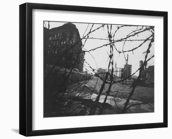 Berlin Wall Stretches Divisionally Between Buildings That Were Once on Common Ground-Paul Schutzer-Framed Photographic Print