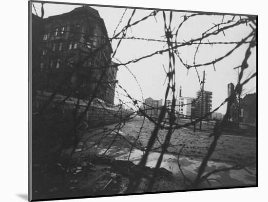 Berlin Wall Stretches Divisionally Between Buildings That Were Once on Common Ground-Paul Schutzer-Mounted Photographic Print