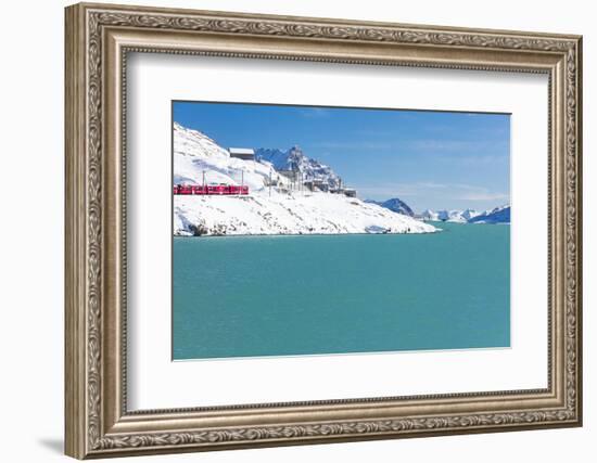 Bernina Express train in the snowy valley surrounded by Lake Bianco, Bernina Pass, Canton of Graubu-Roberto Moiola-Framed Photographic Print