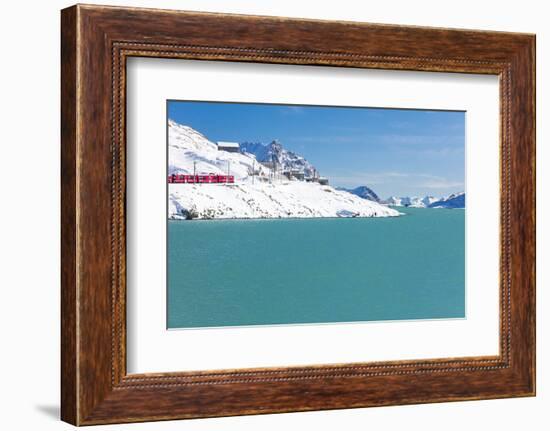 Bernina Express train in the snowy valley surrounded by Lake Bianco, Bernina Pass, Canton of Graubu-Roberto Moiola-Framed Photographic Print