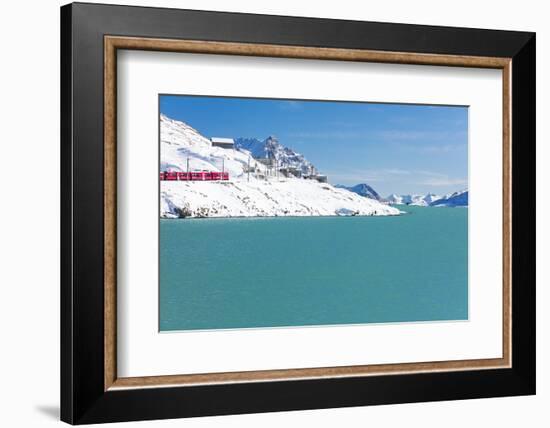 Bernina Express train in the snowy valley surrounded by Lake Bianco, Bernina Pass, Canton of Graubu-Roberto Moiola-Framed Photographic Print