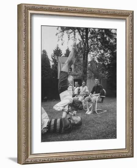 Berta de Fazio Eating Ice Cream from Reb Moore's Mouth in a Handstand-Joe Scherschel-Framed Photographic Print