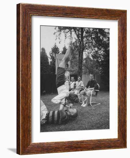 Berta de Fazio Eating Ice Cream from Reb Moore's Mouth in a Handstand-Joe Scherschel-Framed Photographic Print