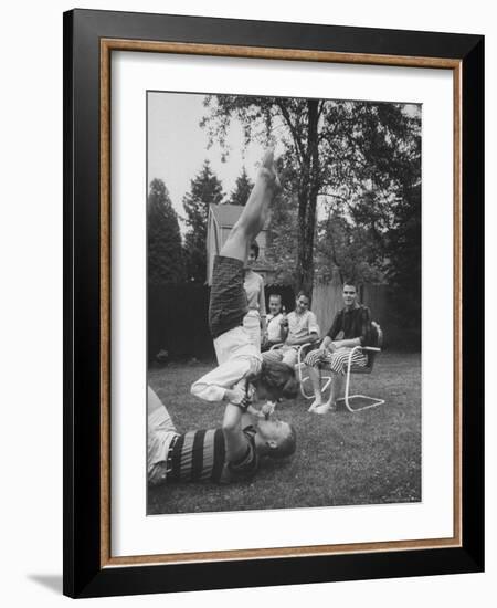 Berta de Fazio Eating Ice Cream from Reb Moore's Mouth in a Handstand-Joe Scherschel-Framed Photographic Print