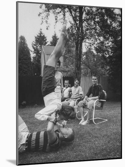 Berta de Fazio Eating Ice Cream from Reb Moore's Mouth in a Handstand-Joe Scherschel-Mounted Photographic Print