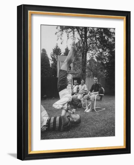 Berta de Fazio Eating Ice Cream from Reb Moore's Mouth in a Handstand-Joe Scherschel-Framed Photographic Print