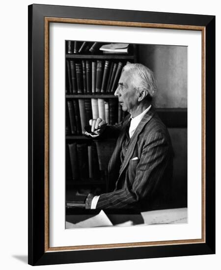 Bertrand Russell Sitting at His Desk at California University at Los Angeles-Peter Stackpole-Framed Photographic Print