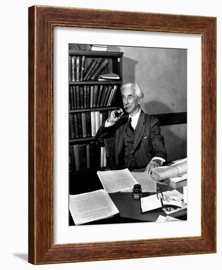 Bertrand Russell Sitting at His Desk at California University at Los Angeles-Peter Stackpole-Framed Photographic Print