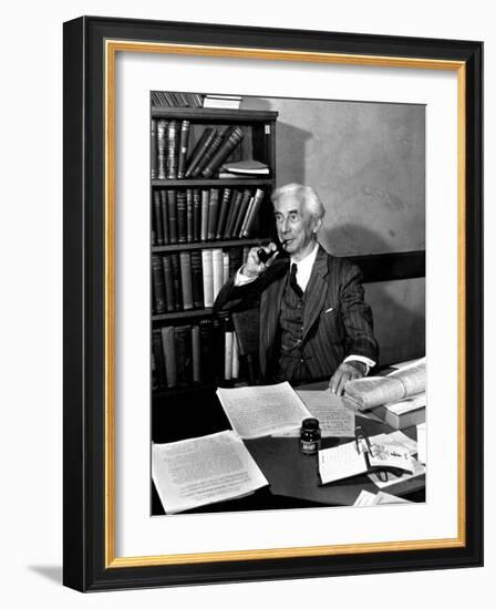 Bertrand Russell Sitting at His Desk at California University at Los Angeles-Peter Stackpole-Framed Photographic Print