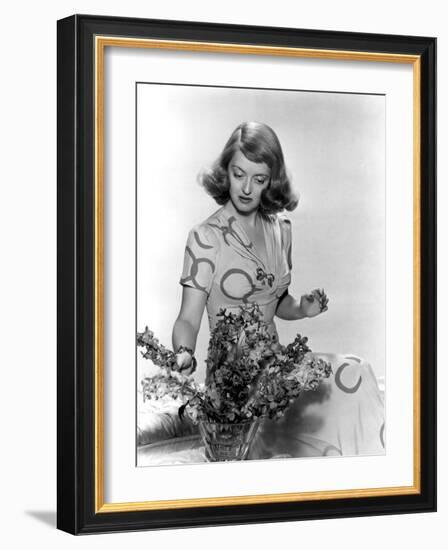 Bette Davis Arranging Flowers-null-Framed Photo