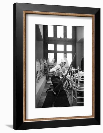 Bettina Graziani Setting Up Seats for Givenchy Runway Show (Will Model In), Paris, France, 1952-Nat Farbman-Framed Photographic Print