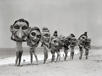 Women Holding Giant Masks-Bettmann-Photographic Print
