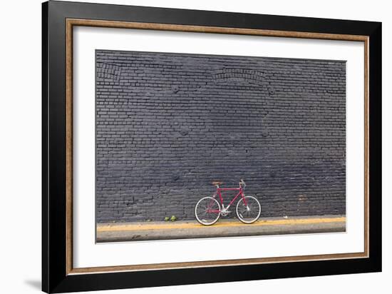 Beverly Hills, Los Angeles, California, USA: A Red Single Speed Bike In Front Of A Black Brick Wall-Axel Brunst-Framed Photographic Print
