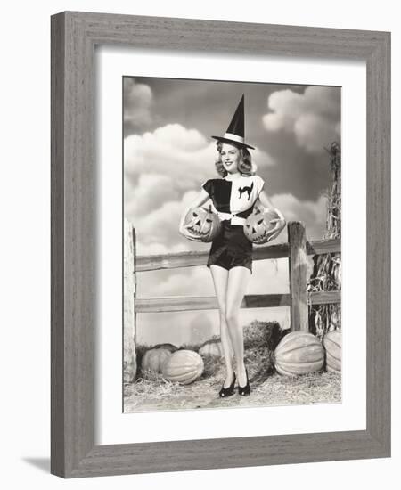 Bewitching Woman Carrying Carved Pumpkins-null-Framed Photo