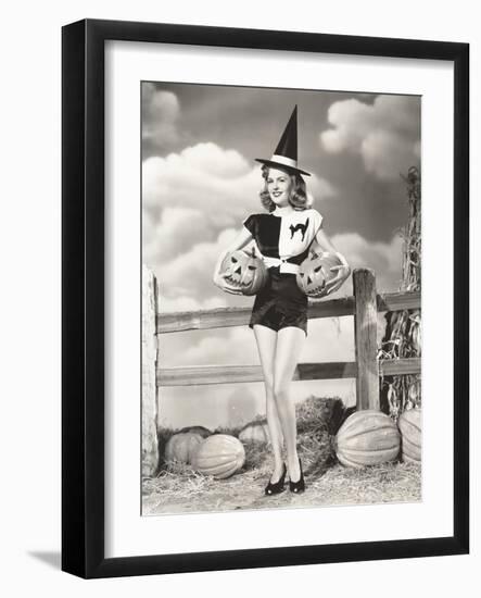 Bewitching Woman Carrying Carved Pumpkins-null-Framed Photo