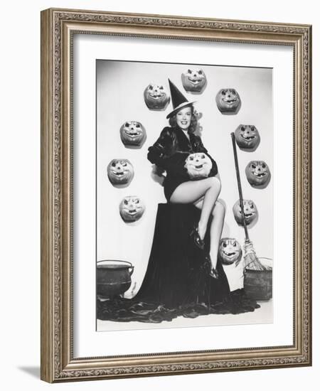 Bewitching Woman Sitting Among Carved Pumpkins-null-Framed Photo