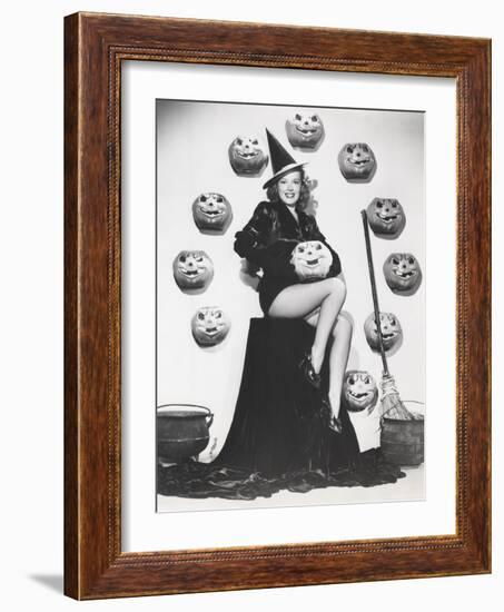 Bewitching Woman Sitting Among Carved Pumpkins-null-Framed Photo