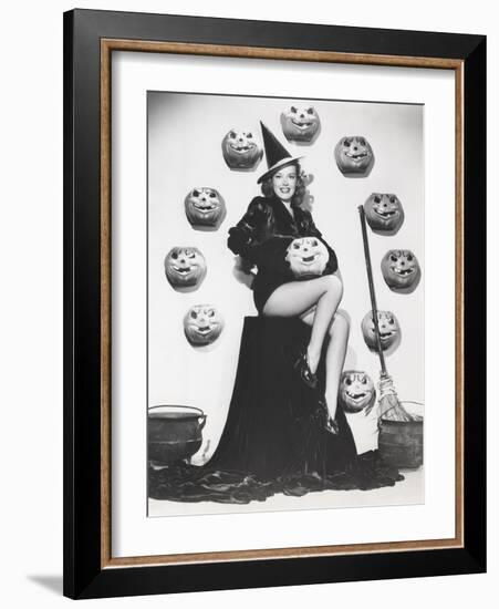 Bewitching Woman Sitting Among Carved Pumpkins-null-Framed Photo