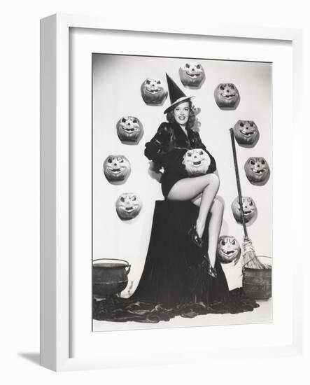 Bewitching Woman Sitting Among Carved Pumpkins-null-Framed Photo
