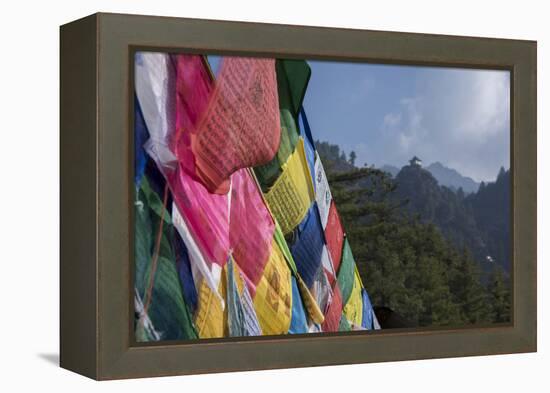 Bhutan, Paro. Colorful prayer flags in front of small outbuilding of the Tiger's Nest.-Cindy Miller Hopkins-Framed Premier Image Canvas