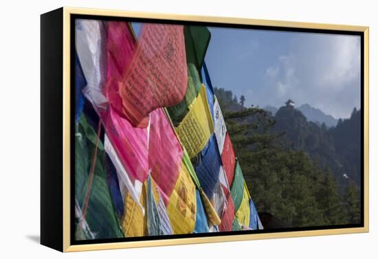 Bhutan, Paro. Colorful prayer flags in front of small outbuilding of the Tiger's Nest.-Cindy Miller Hopkins-Framed Premier Image Canvas