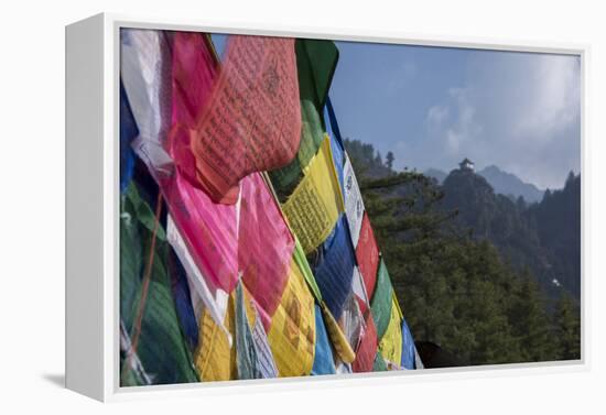 Bhutan, Paro. Colorful prayer flags in front of small outbuilding of the Tiger's Nest.-Cindy Miller Hopkins-Framed Premier Image Canvas