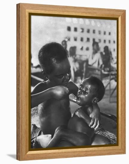 Biafran Child Feeding Another Child-Terence Spencer-Framed Premier Image Canvas