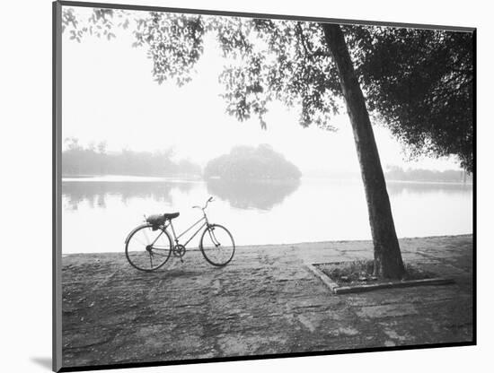 Bicycle and Bay Mau Lake Lenin Park-Walter Bibikow-Mounted Photographic Print