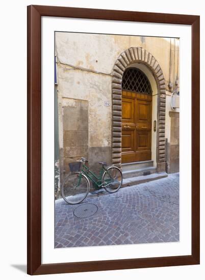 Bicycle parked outside front door, Lucca, Tuscany, Italy, Europe-John Guidi-Framed Photographic Print