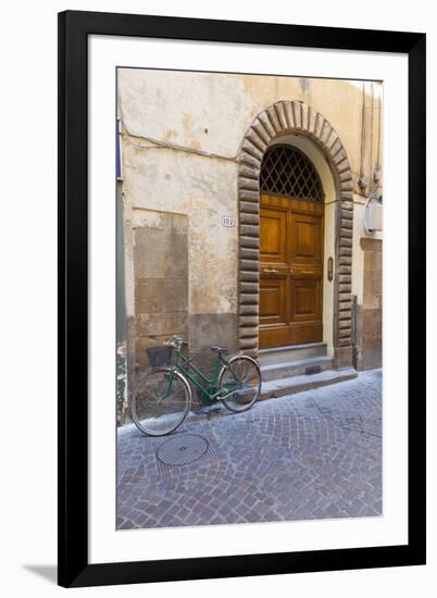 Bicycle parked outside front door, Lucca, Tuscany, Italy, Europe-John Guidi-Framed Photographic Print