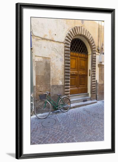 Bicycle parked outside front door, Lucca, Tuscany, Italy, Europe-John Guidi-Framed Photographic Print