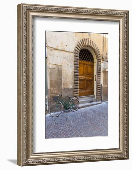 Bicycle parked outside front door, Lucca, Tuscany, Italy, Europe-John Guidi-Framed Photographic Print