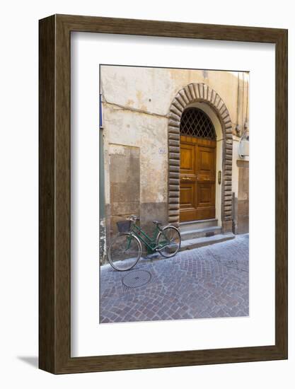 Bicycle parked outside front door, Lucca, Tuscany, Italy, Europe-John Guidi-Framed Photographic Print